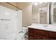 Clean bathroom featuring a tub, shower, and wood vanity at 1731 W Steinway Dr, Phoenix, AZ 85041