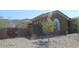 Side view of house with wooden gate and mountain backdrop at 1731 W Steinway Dr, Phoenix, AZ 85041