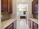 Walk-in pantry with granite countertops and wood cabinets at 1731 W Steinway Dr, Phoenix, AZ 85041