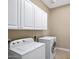 Bright laundry room with Whirlpool washer and dryer at 1731 W Steinway Dr, Phoenix, AZ 85041