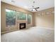 Living room with fireplace and large windows at 1731 W Steinway Dr, Phoenix, AZ 85041