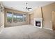 Living room with fireplace, high ceilings, and large windows at 1731 W Steinway Dr, Phoenix, AZ 85041