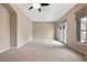 Large living room with neutral carpet and high ceilings at 1731 W Steinway Dr, Phoenix, AZ 85041