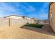 Artificial turf and fire pit in a spacious backyard at 17662 W Daley Ln, Surprise, AZ 85387