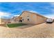 Spacious backyard with artificial turf and fire pit at 17662 W Daley Ln, Surprise, AZ 85387