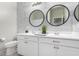 Bathroom with double sinks and modern fixtures at 17662 W Daley Ln, Surprise, AZ 85387