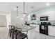 Modern kitchen with granite island and stainless steel appliances at 17662 W Daley Ln, Surprise, AZ 85387