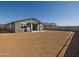 View of the spacious backyard, ready for landscaping, showcasing the property's potential at 17755 W Elm St, Goodyear, AZ 85395