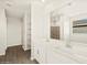 Bathroom featuring tiled floors and vanity with dual sinks at 17755 W Elm St, Goodyear, AZ 85395