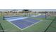 Two pickleball courts with blue surfaces at 17755 W Elm St, Goodyear, AZ 85395