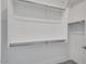 Large walk-in closet with double hanging rods and shelving at 18104 W Silverwood Dr, Goodyear, AZ 85338