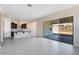 Living area with sliding glass doors leading to a patio at 18104 W Silverwood Dr, Goodyear, AZ 85338