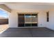 Covered patio with sliding glass doors and cement flooring at 18104 W Silverwood Dr, Goodyear, AZ 85338