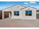 House exterior showcasing backyard and patio at 18111 W Hiddenview Dr, Goodyear, AZ 85338