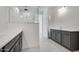 Modern bathroom with double vanity and glass shower at 18111 W Hiddenview Dr, Goodyear, AZ 85338