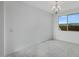 Bright dining room with large window and chandelier at 18111 W Hiddenview Dr, Goodyear, AZ 85338