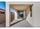 Covered patio with concrete flooring and sliding glass door at 18111 W Hiddenview Dr, Goodyear, AZ 85338