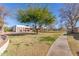 Community view with green lawns and mature trees at 1833 W Citrus Way, Phoenix, AZ 85015