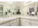 Bright bathroom with double sinks, white cabinets, and a large mirror at 1833 W Citrus Way, Phoenix, AZ 85015
