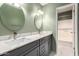 Modern bathroom with double vanity and a shower/tub combo at 1833 W Citrus Way, Phoenix, AZ 85015