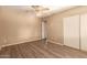 Spacious bedroom with ceiling fan and built-in closet at 1833 W Citrus Way, Phoenix, AZ 85015