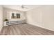 Bedroom boasts wood-look flooring, shutters and built-in shelves at 1833 W Citrus Way, Phoenix, AZ 85015