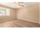 Bright bedroom with ceiling fan and laminate flooring at 1833 W Citrus Way, Phoenix, AZ 85015