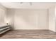 Large bedroom boasts wood-look flooring, bright window and ceiling fan at 1833 W Citrus Way, Phoenix, AZ 85015