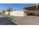 Tan block wall and carport with trash bins at 1833 W Citrus Way, Phoenix, AZ 85015