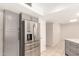 Well-appointed kitchen featuring gray cabinets, stainless steel refrigerator, and plenty of storage space at 1833 W Citrus Way, Phoenix, AZ 85015
