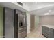 Modern kitchen with stainless steel refrigerator and gray cabinets at 1833 W Citrus Way, Phoenix, AZ 85015