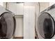 Laundry room with washer, dryer, and utility cabinet at 1833 W Citrus Way, Phoenix, AZ 85015