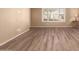 Living room with wood-look floors, neutral walls, and window at 1833 W Citrus Way, Phoenix, AZ 85015