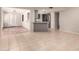 Open-concept living area with gray kitchen and tile flooring, great for modern living at 1833 W Citrus Way, Phoenix, AZ 85015