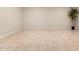 Spacious living room area with neutral tile flooring and a green potted plant at 1833 W Citrus Way, Phoenix, AZ 85015