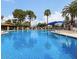 Large community pool with palm trees and lounge seating at 1833 W Citrus Way, Phoenix, AZ 85015