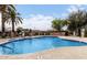 Community pool and deck with seating, surrounded by manicured landscaping at 1833 W Citrus Way, Phoenix, AZ 85015