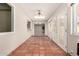 Bright sun room featuring terracotta tile floors and view into a living area at 1833 W Citrus Way, Phoenix, AZ 85015