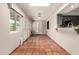 Bright sun room with tile flooring, skylight, and access to the kitchen at 1833 W Citrus Way, Phoenix, AZ 85015