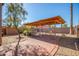 Backyard patio area with pergola and brick pavers at 18466 N 5Th Ave, Phoenix, AZ 85023