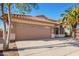 Attractive single-story home with a two-car garage and desert landscaping at 18466 N 5Th Ave, Phoenix, AZ 85023