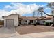 House exterior features a two-car garage and desert landscaping at 1913 E Sandra Ter, Phoenix, AZ 85022