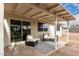 Relaxing covered patio with seating area and sliding glass door access at 1913 E Sandra Ter, Phoenix, AZ 85022