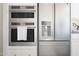 Stainless steel built-in oven, microwave, and refrigerator at 20317 W Turney Ave, Buckeye, AZ 85396