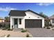 Craftsman style home with two-tone exterior and a two car garage at 20317 W Turney Ave, Buckeye, AZ 85396