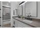 Modern bathroom with double sinks, gray countertops, and sleek fixtures at 205 W Blue Ridge Way, Chandler, AZ 85248