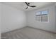 Well-lit bedroom with neutral carpeting and window coverings at 205 W Blue Ridge Way, Chandler, AZ 85248