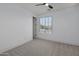 Spacious bedroom with window, ceiling fan, and neutral wall color at 205 W Blue Ridge Way, Chandler, AZ 85248