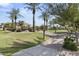 Community park with walking paths, benches, and palm trees at 205 W Blue Ridge Way, Chandler, AZ 85248