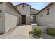 Attractive front entrance with stone accents and a paved walkway at 205 W Blue Ridge Way, Chandler, AZ 85248